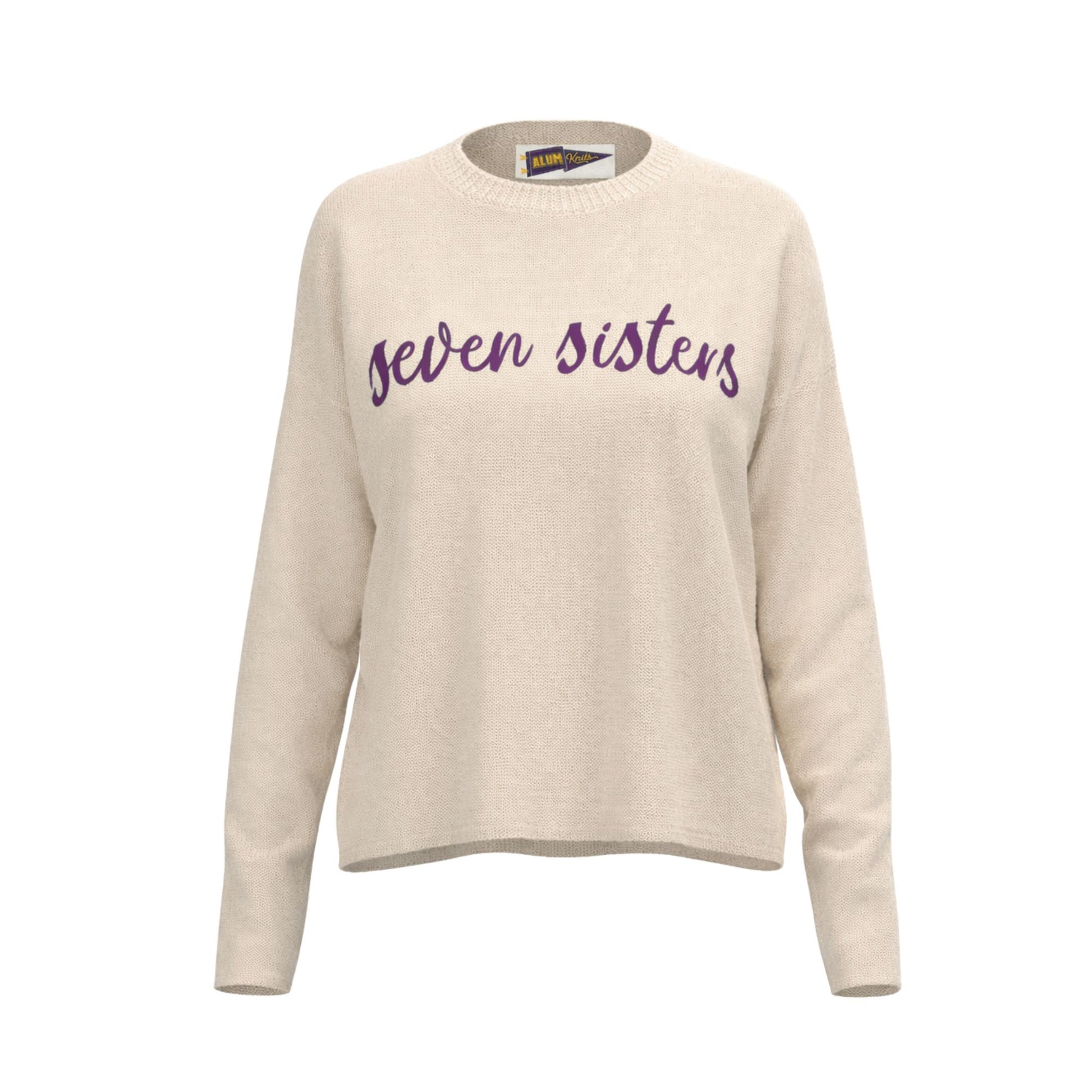 Beige sweater with 'Seven Sisters' text on a white background